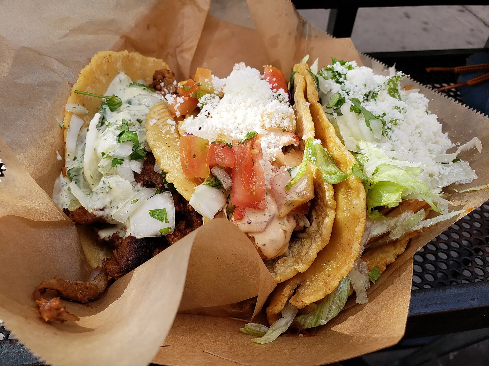 Three loaded tacos from a San Diego taco shop, a taste of the best tacos in San Diego