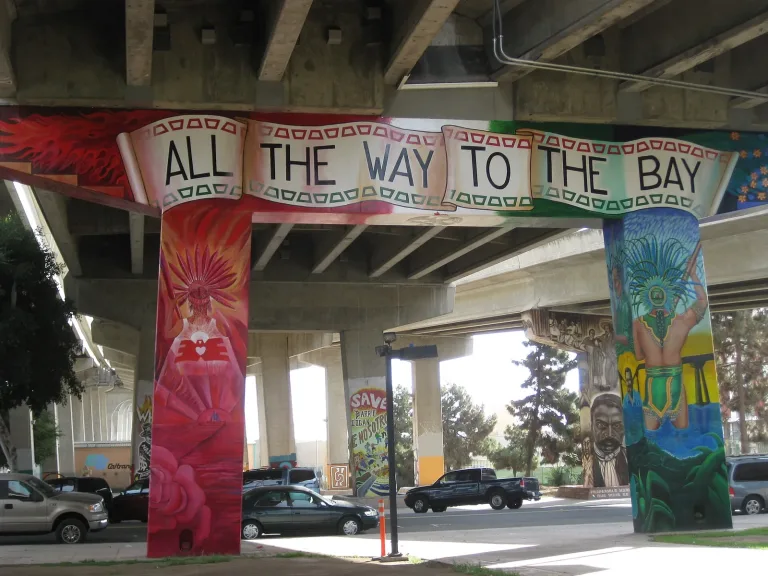 The All the Way to the Bay mural painted on freeway pillars in Chicano Park